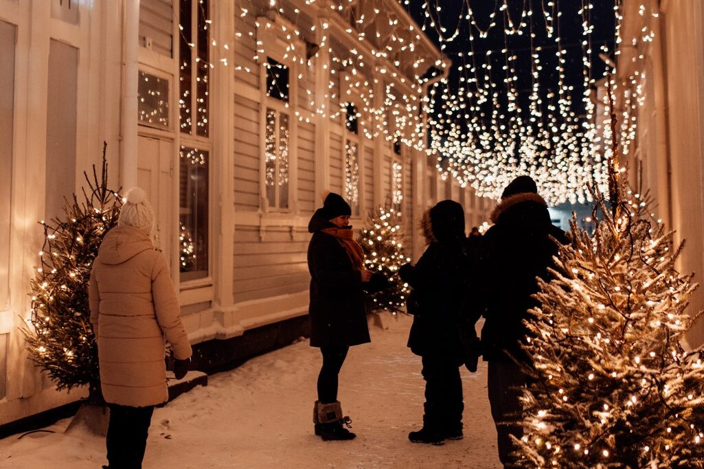 People in a spruce alley in Old Rauma