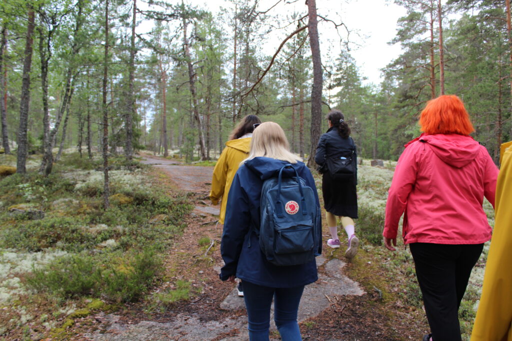 People walking in Sammallahdenmäki.