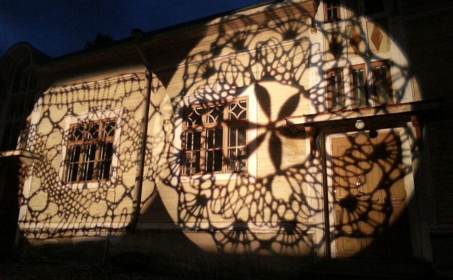 Light lace work on the wall of Seppä House.