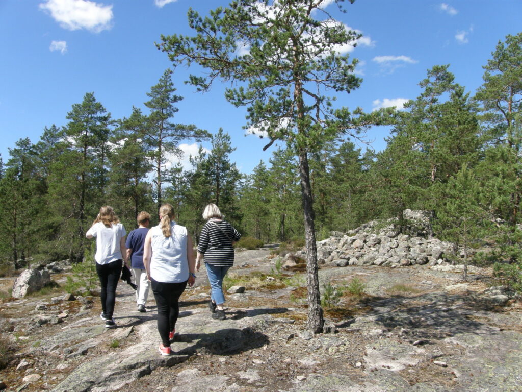 People walking in Sammallahdenmäki.