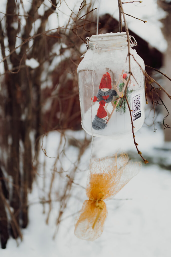 Decorative elf in a glass jar in The Christmas Elf Courtyard in Tammela.