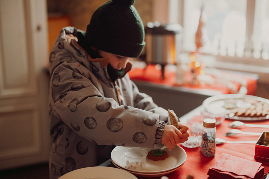 A child decorating gingerbreads.