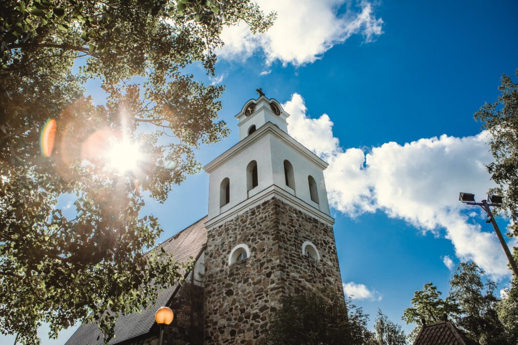 The tower of the Church of the Holy Cross in sunlight.